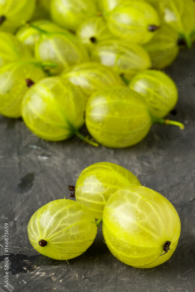 Heap of ripe, fresh harvested green gooseberry fruit Heap of ripe, fresh harvested green gooseberry fruit