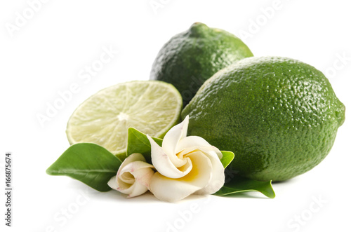 green lime with half of  juicy lime and beautifull flower isolated on white background