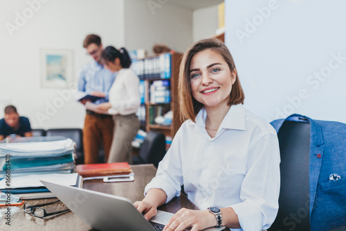 Businesswoman smiling in office photo