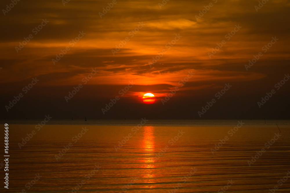 Sunset with reflection into the sea