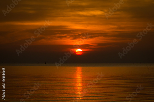Sunset with reflection into the sea © muzicmanjy
