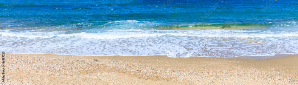 Sandy beach and blue sea background