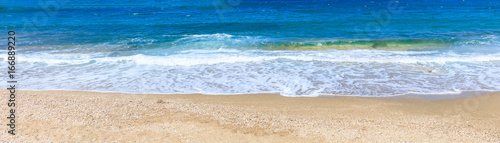 Sandy beach and blue sea background