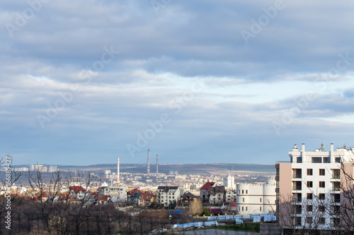 City view with cloudy sky.