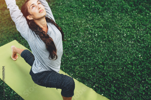 Obraz na plátně Portrait of happiness young woman practicing yoga on outdoors