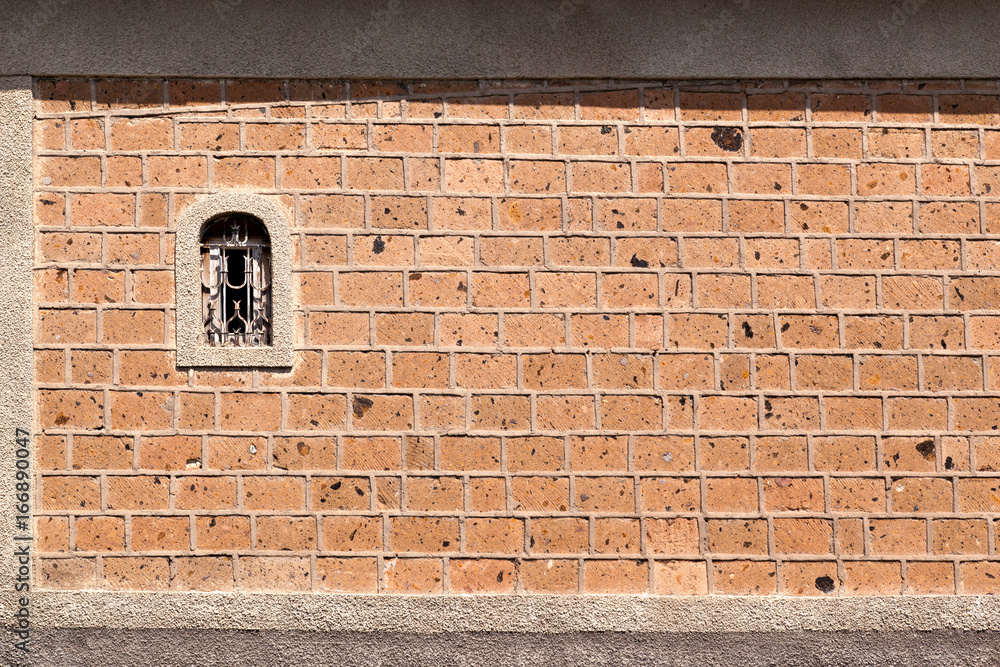The window in the wall of the masonry of the Armenian tuff The window in the wall of the masonry of the Armenian tuff