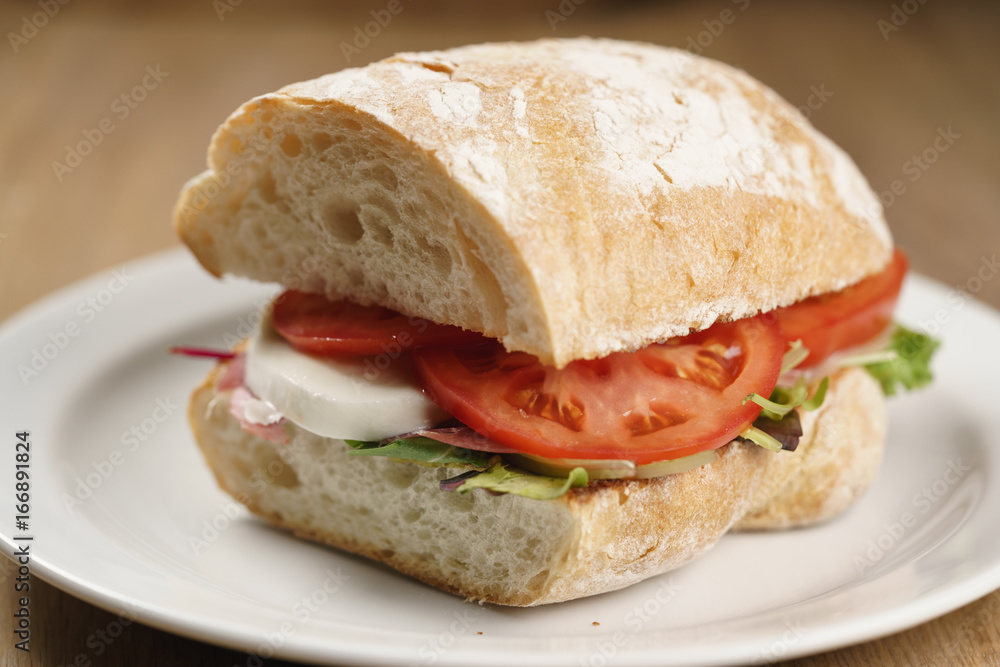 ciabatta sandwich with speck, mozzarella and vegetables ciabatta sandwich with speck, mozzarella and vegetables