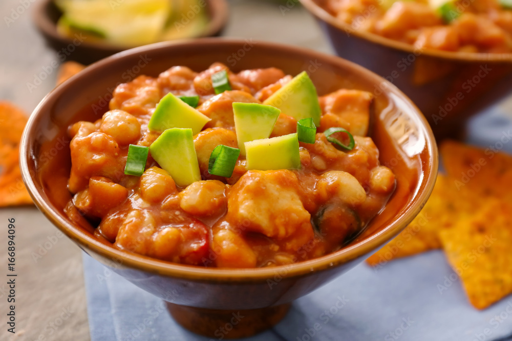 Bowl with delicious turkey chili on table Bowl with delicious turkey chili on table