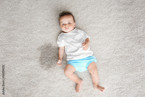 Little adorable girl lying ...
