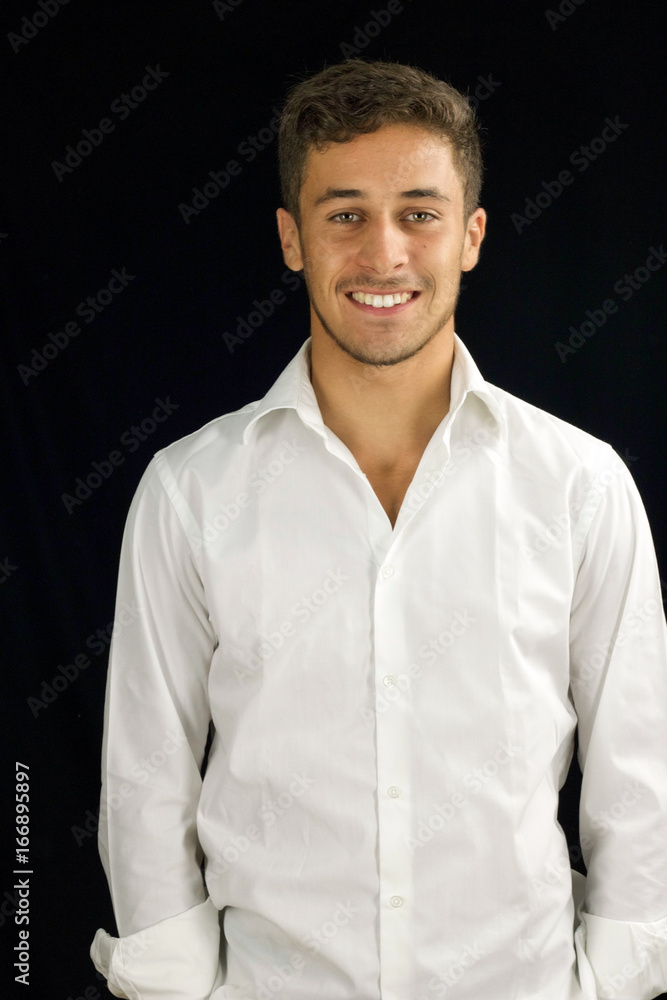 portrait of handsome young man smiling on black background portrait of handsome young man smiling on black background