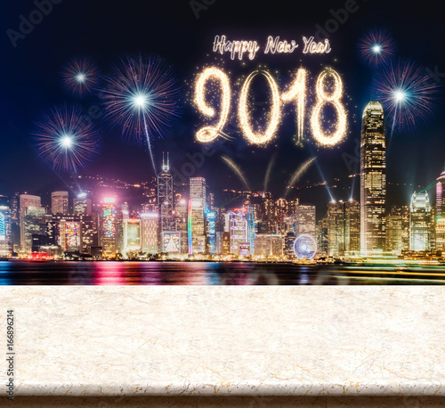 Happy new year 2018 fireworks over cityscape at night with empty marble table top,Mock up template for display or montage of product for social media advertising