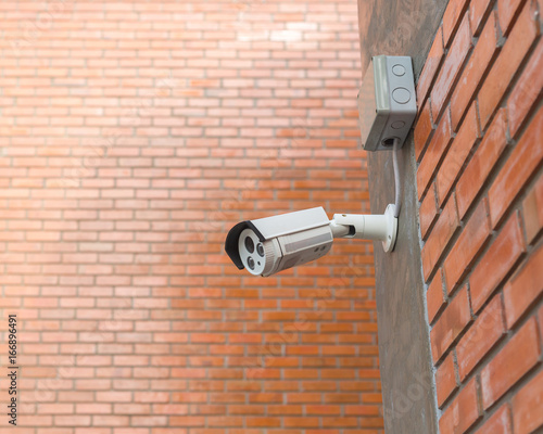 CCTV Security Camera. Security camera mounted on the outdoors brick wall