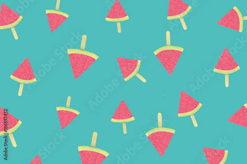 Fresh watermelon slices patterned on green background, top view