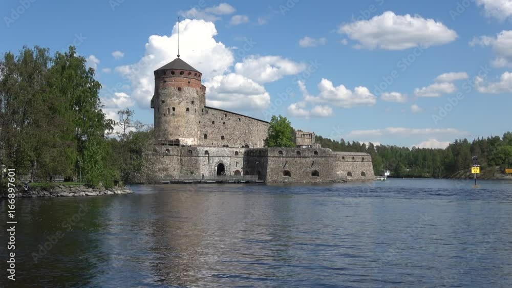 View of the medieval fortress Olavinlinna. Sunny day in july. Savonlinna, Finland View of the medieval fortress Olavinlinna. Sunny day in july. Savonlinna, Finland