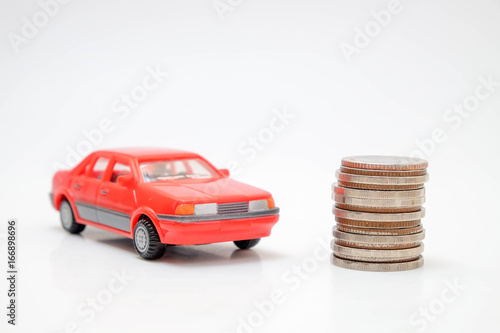 save money for investment concept Toy car and stack of coins