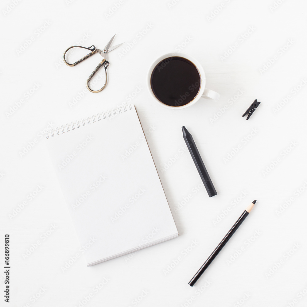Workspace with notebook, cup of coffee, pencils. Business concept. Flat lay, top view, square Workspace with notebook, cup of coffee, pencils. Business concept. Flat lay, top view, square