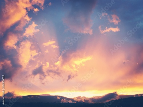 Colorful sunset sky over mountains
