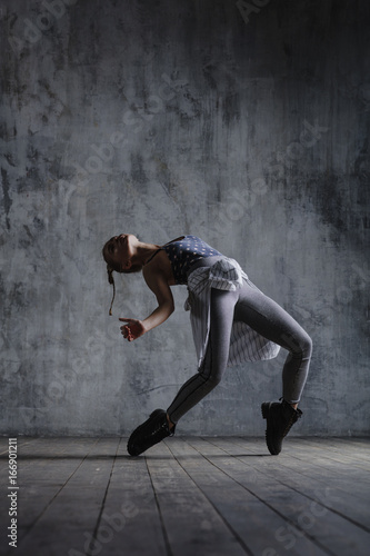 Young beautiful dancer is posing in studio © Alexander Y