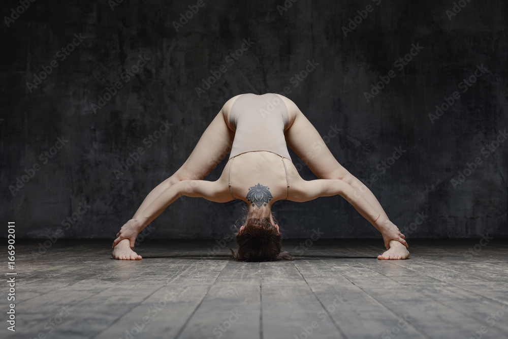 Young beautiful fitness female posing in studio Young beautiful fitness female posing in studio