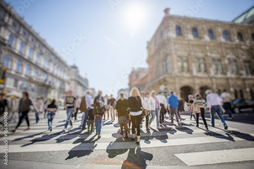 Abstract Image of Business People Walking on the Street and cityscape background