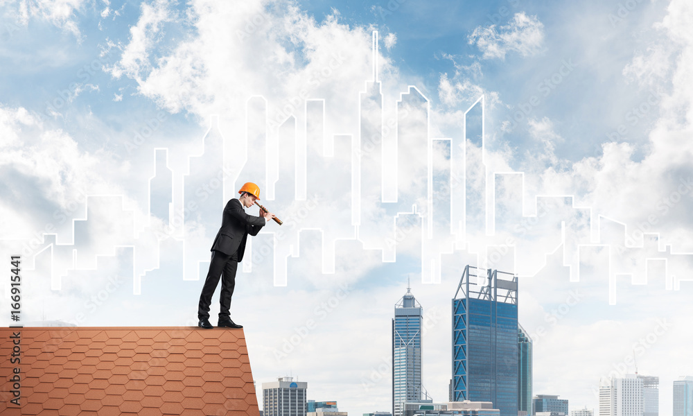 Engineer man standing on roof and looking in spyglass. Mixed media Engineer man standing on roof and looking in spyglass. Mixed media