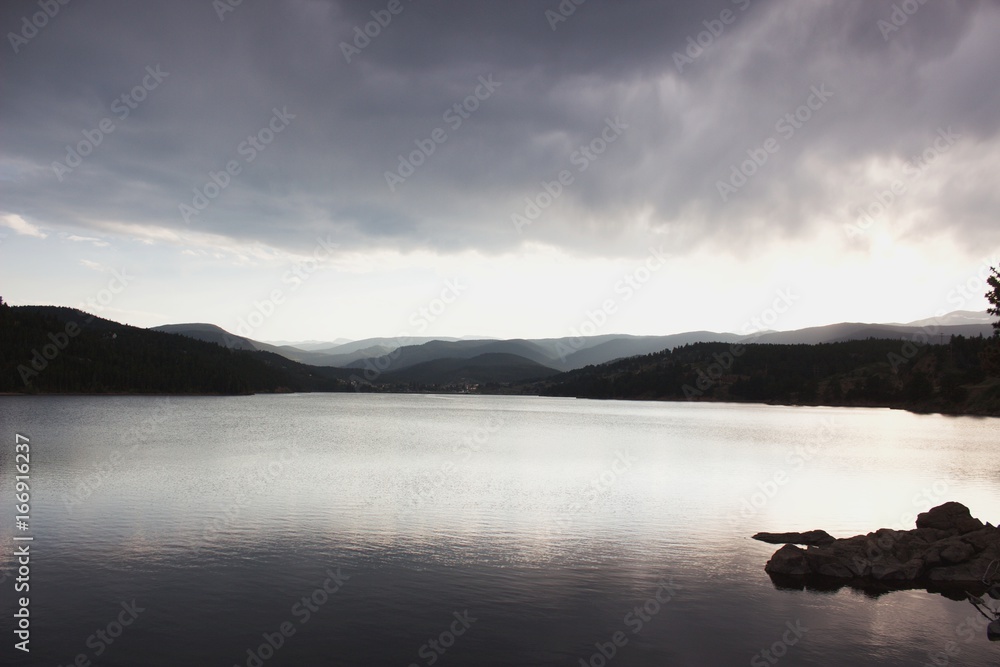 Fototapeta premium Foggy mountains at sunset