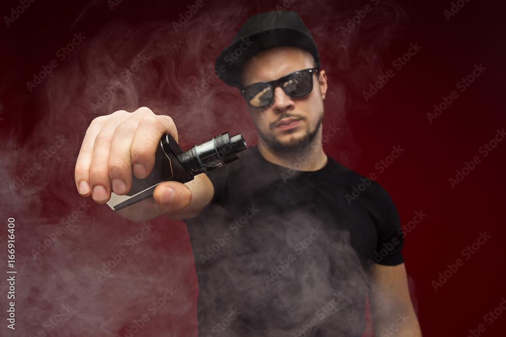 Vaping man and a cloud of vapor Vaping man and a cloud of vapor