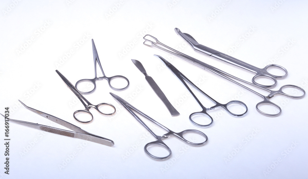 Close Up Surgical instruments and tools on white background. Selective focus. Close Up Surgical instruments and tools on white background. Selective focus.