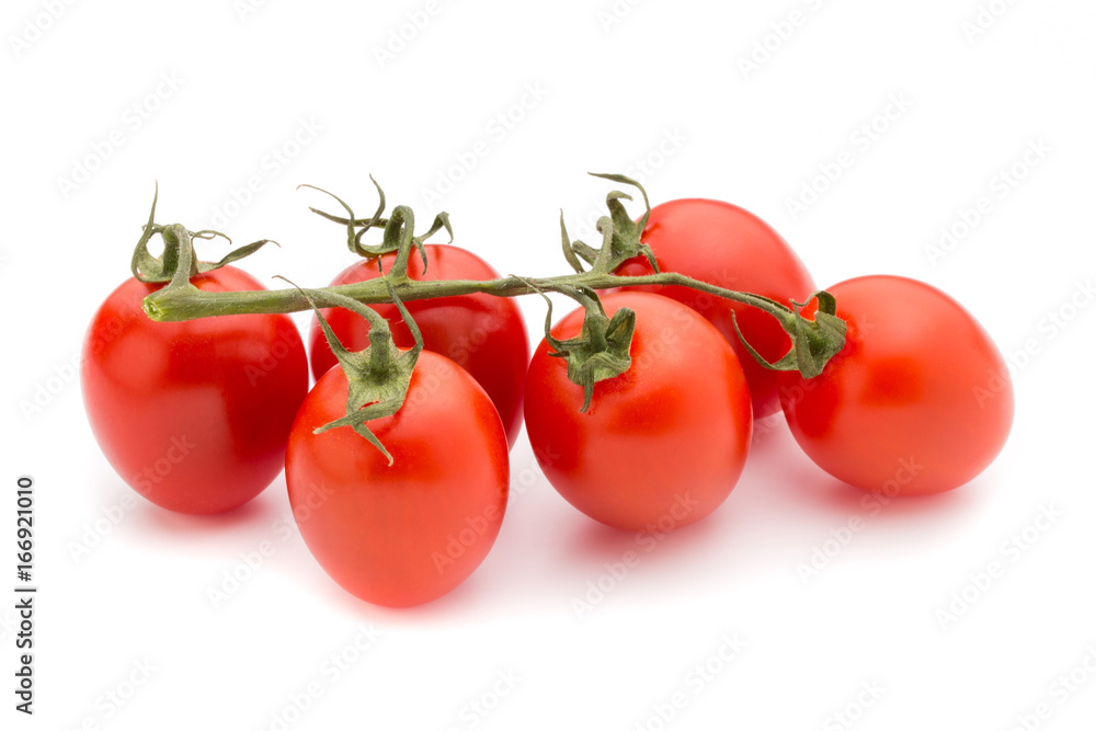 Small plum tomatoes on a white background. Small plum tomatoes on a white background.