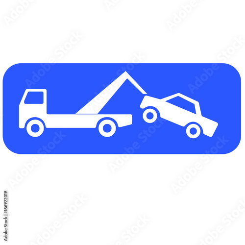 Tow truck lifting a car