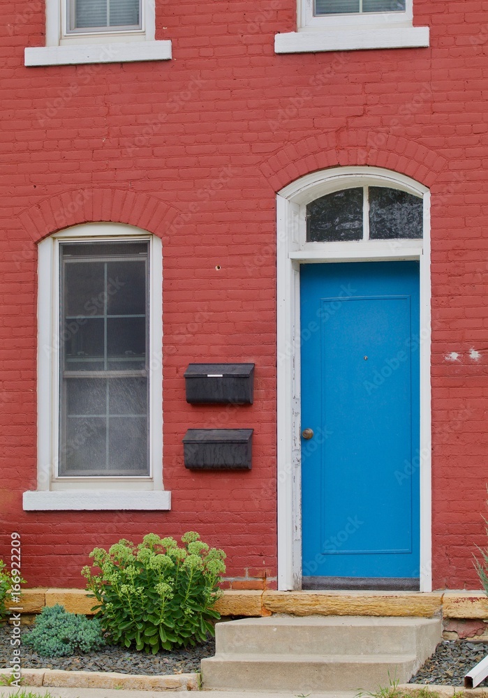 Blue Door, Red House Stock Photo | Adobe Stock
