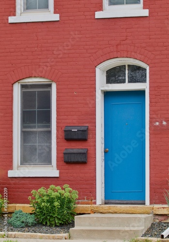 Blue door, red house