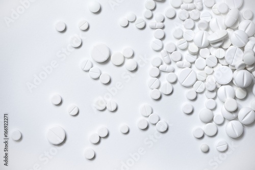 White pills, white background