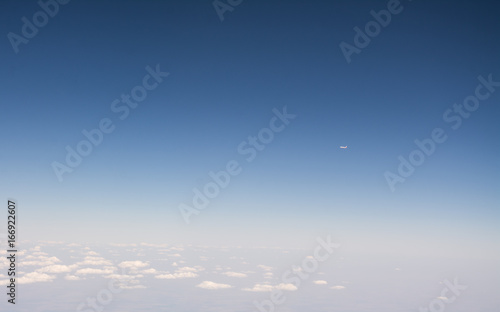 small airplane on the blue sky