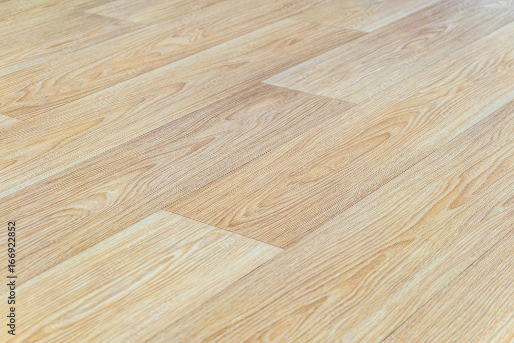 Linoleum flooring with embossed light wood texture closeup. Horizontal