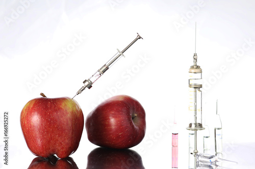 Genetically modified foods, apple pumped with chemicals
