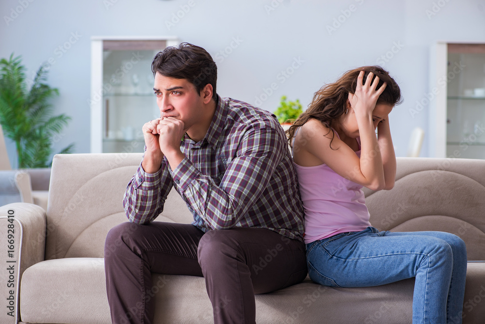 Fototapeta premium Young family in broken relationship concept