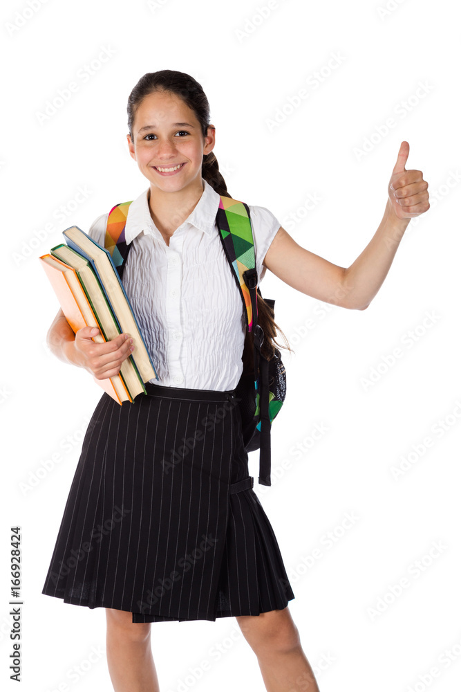 Happy schoolgirl standing with book and thumb up sign Happy schoolgirl standing with book and thumb up sign
