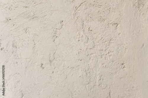 Grunge beige vintage wall with cracks 
