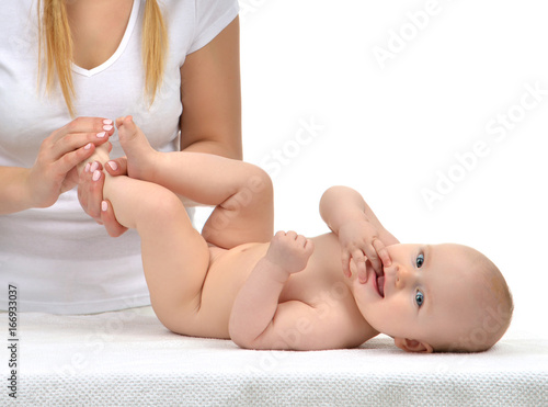 Doctor hands pediatrician therapist making massage to child infant baby feet