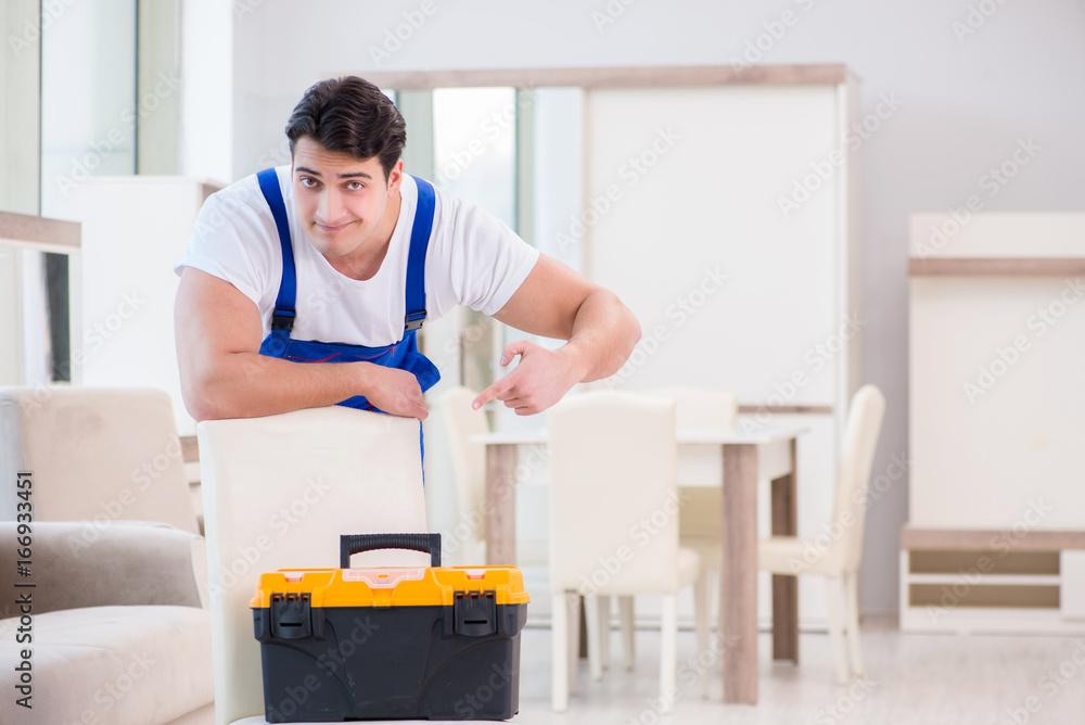 Obraz premium Furniture repairman working in store