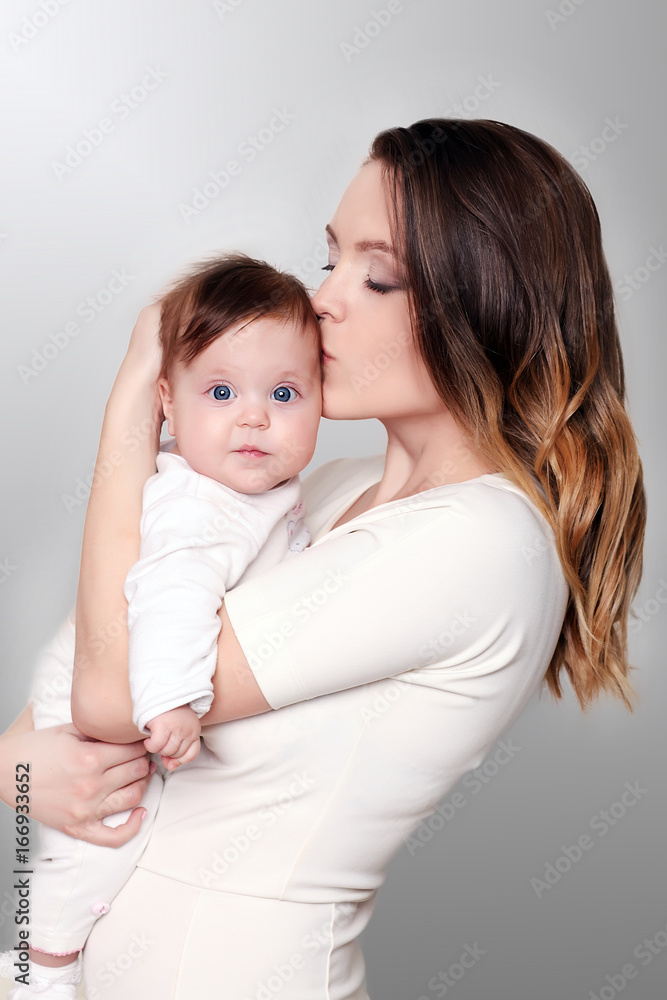 happy caring mother and her cute baby girl happy caring mother and her cute baby girl