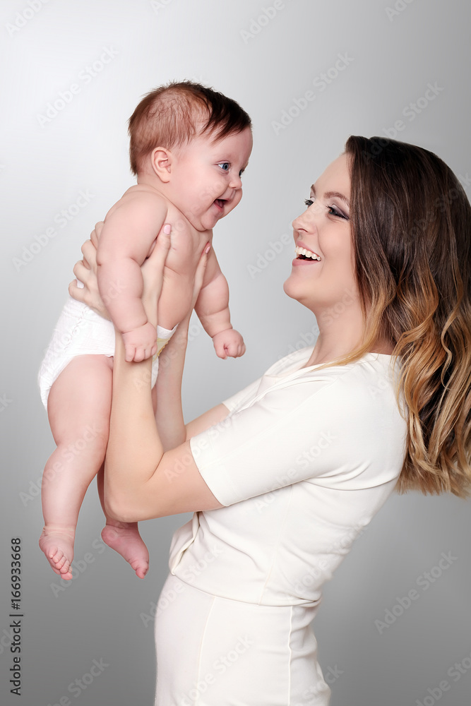 happy caring mother and her cute baby girl happy caring mother and her cute baby girl