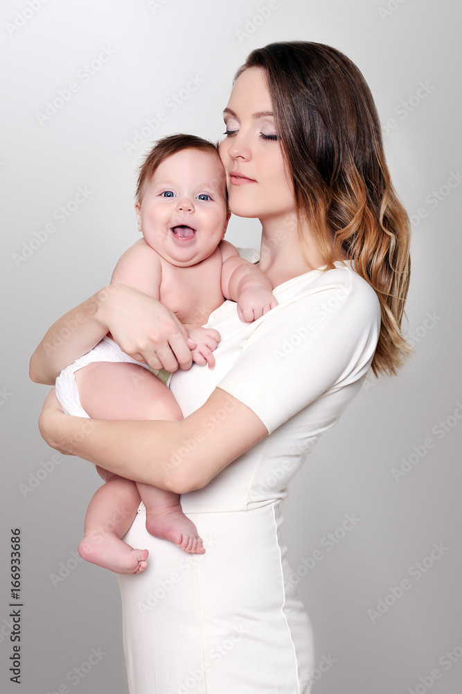 happy caring mother and her cute baby girl happy caring mother and her cute baby girl
