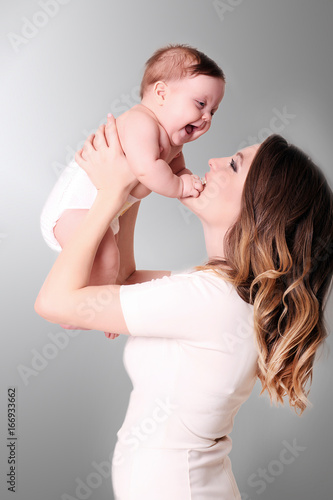 happy caring mother and her cute baby girl