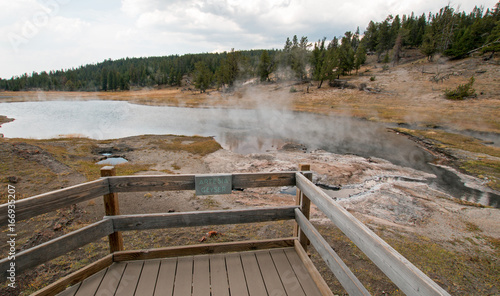 Artesia Geyser next to Firehole Lake in the Lower Geyser Basin in Yellowstone National Park in Wyoming United States photo