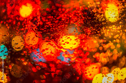 Glowing drop. Blurred droplets. Blurred light. © Grispb