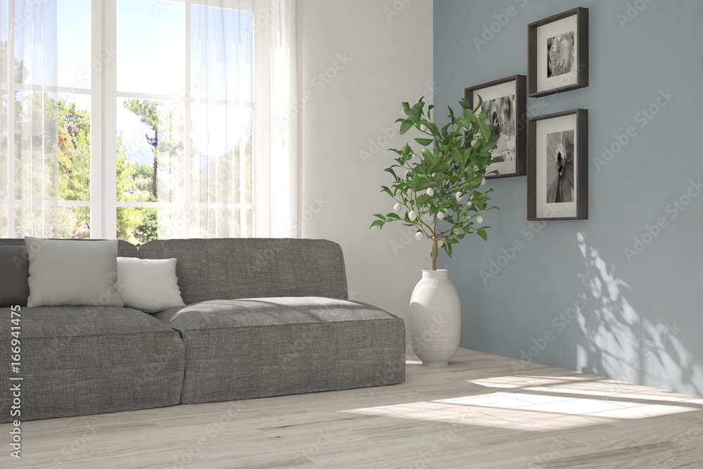 Fototapeta premium Idea of white room with sofa and summer landscape in window. Scandinavian interior design. 3D illustration