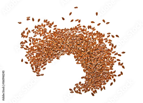 Dried flaxseeds on a white background, top view