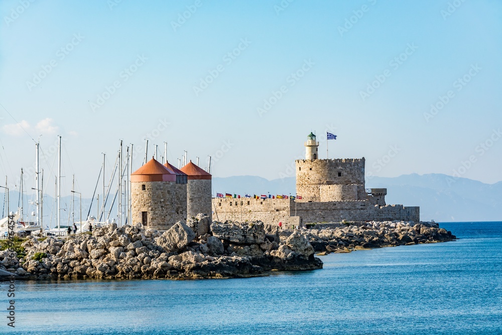 Agios Nikolaos Fort (Fort of Saint Nicholas) and mills, at the entrance to Mandraki harbor, Rhodes island, Greece
